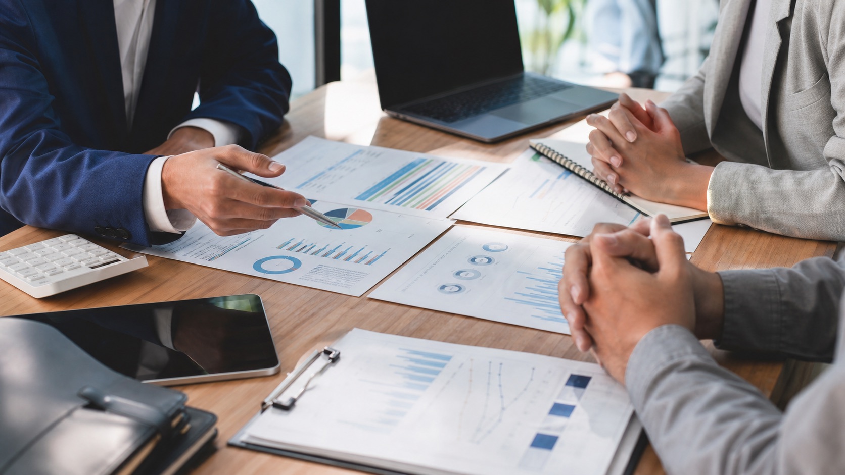 Advisors reviewing a small business funding pitch deck and growth plan